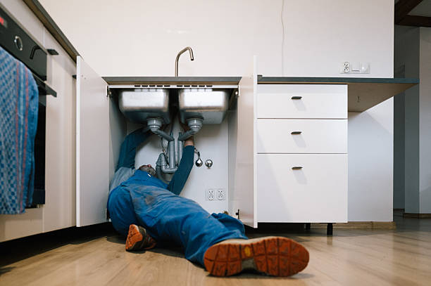 Professional Plumbing technician working in Ashippun, WI